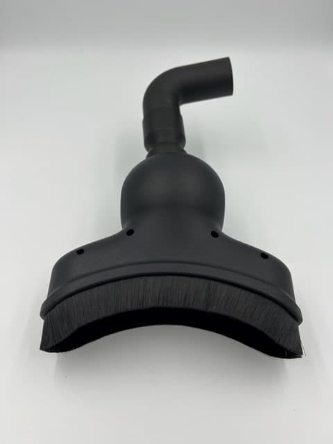 Vacuum Cleaner Attachment Having A Concave Vacuum Head With A Swivel Joint That Swivels Only Within A Central Plane Of The Vacuum Head