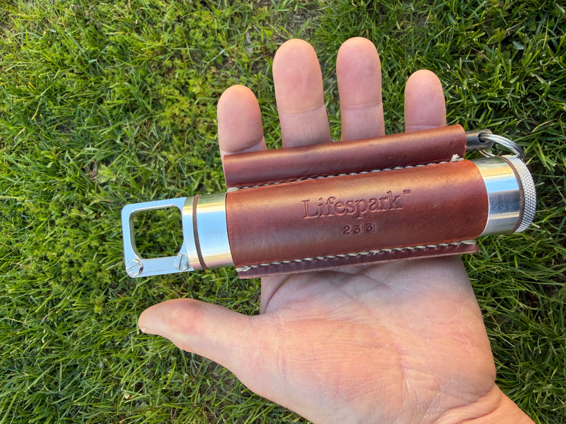 Handheld Storage Tube Having An Externally Integrated Firestarter - Image 1