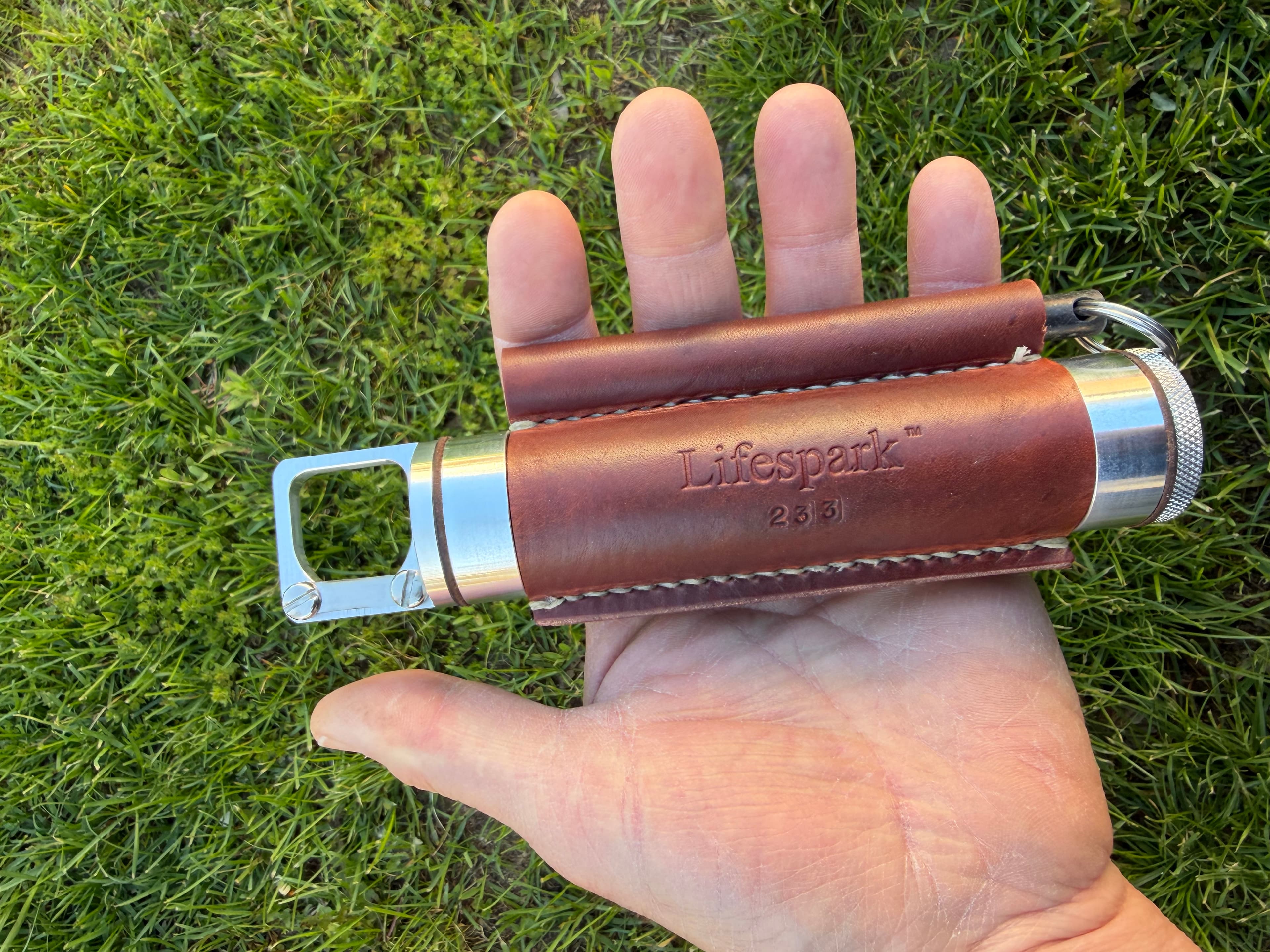 Handheld Storage Tube Having An Externally Integrated Firestarter